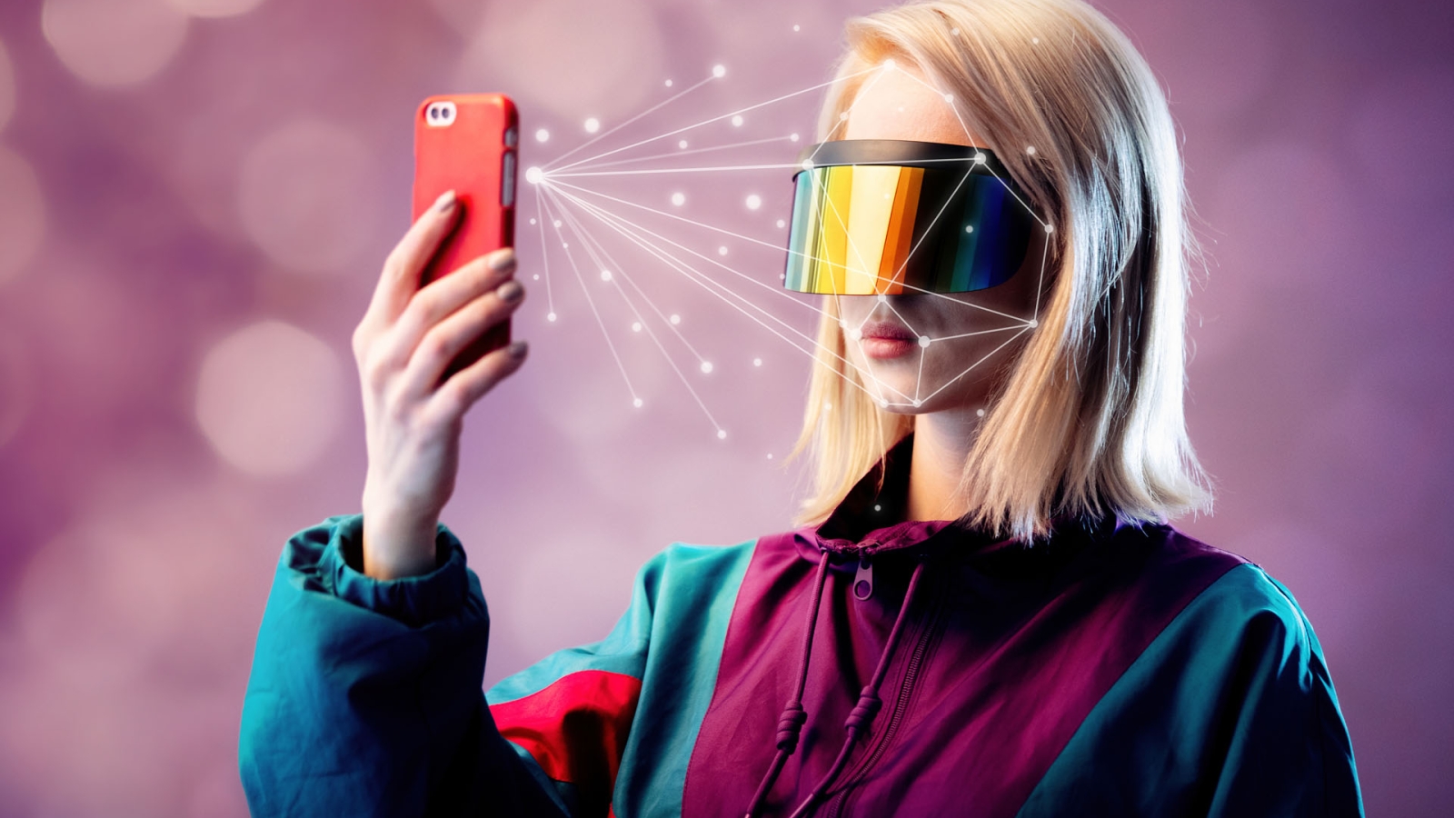 Blonde in VR glasses hold mobile phone with face scanning algorithm